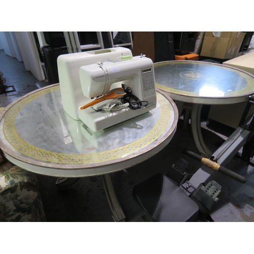 81 - Two circular tables on tripod base with patterned glass top