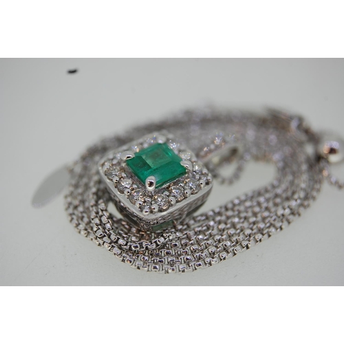 199 - 18 ct. white gold emerald and diamond pendant on an 18 ct. white gold chain