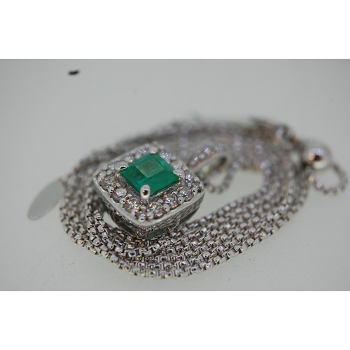 199 - 18 ct. white gold emerald and diamond pendant on an 18 ct. white gold chain