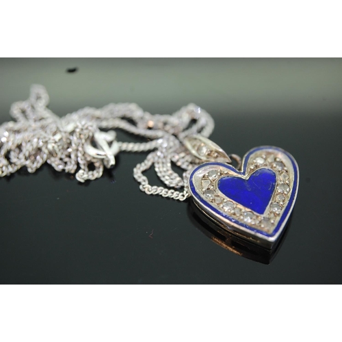 205 - An unusual heart shaped silver blue enamel and diamond pendant on a silver chain