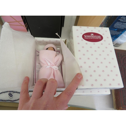 227 - Seven dolls boxed