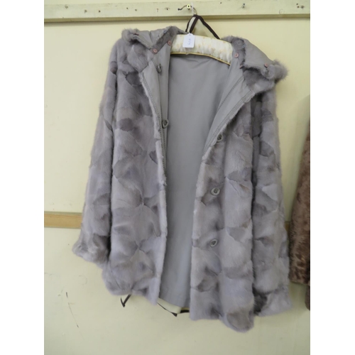 489 - A reversible grey fur ladies  rain jacket