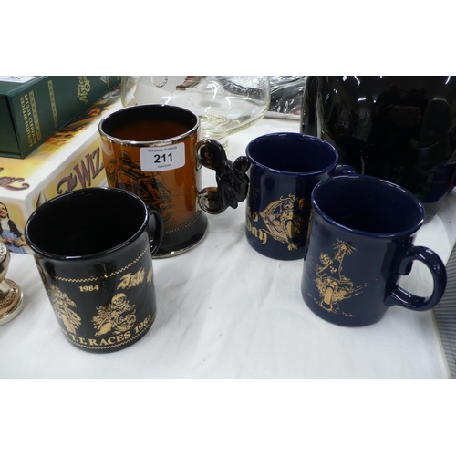 211 - Four ceramic mugs depicting motorcycle racing