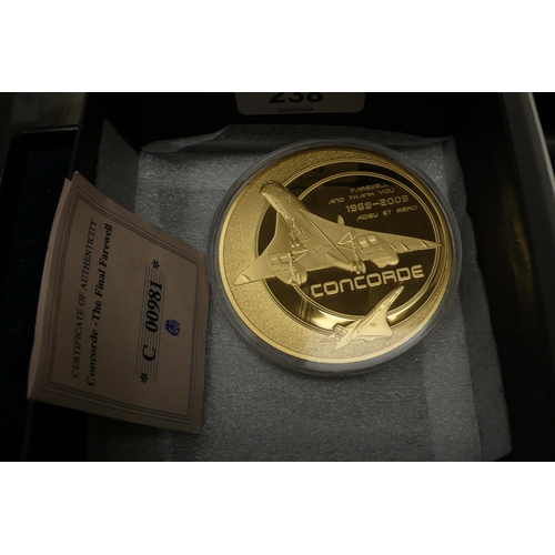 238 - A 2003 gold plated medallion 'Concorde the final farewell'