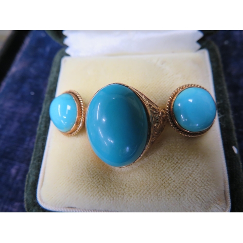 389 - 14 ct. gold oval turquoise ring- size V together with a pair of gold turquoise ear studs