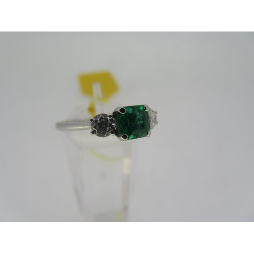 399 - 18ct white gold square emerald cut, emerald and diamond three stone ring, emerald 0.66 carats, size ... 