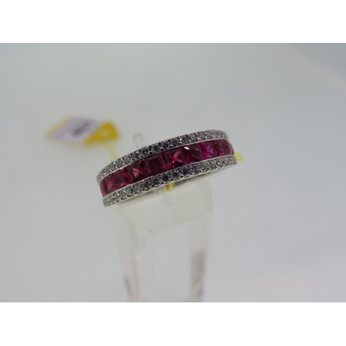 401 - 18ct white gold three row ruby and diamond half eternity ring, size O