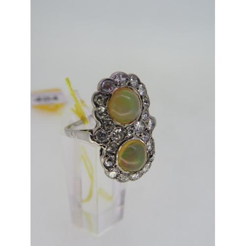 404 - Unusual 18 ct. white gold ring set with cabochon opals surrounded by opals - size Q