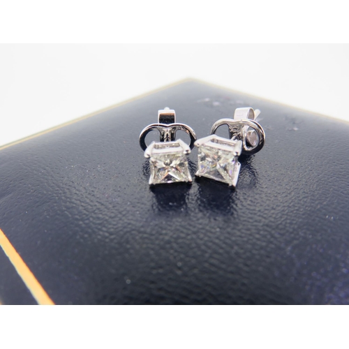 406 - Pair of 18 ct. white gold Princess cut diamond studs - 1 ct.