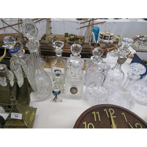 12 - Twelve decanters and other bottles