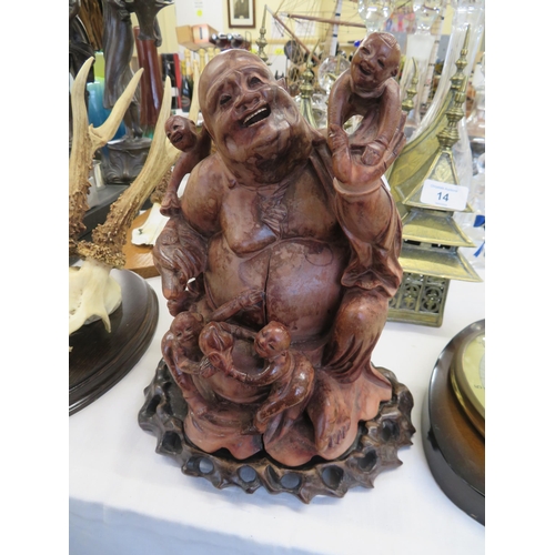 15 - A carved wooden Buddha