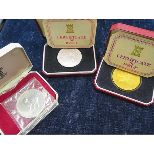 262 - Three Isle of Man silver crowns in cases