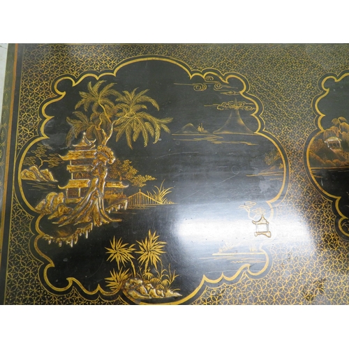 307 - A 1920s set of black lacquered Chinoiserie decorated furniture consisting of two drawer table, elbow... 