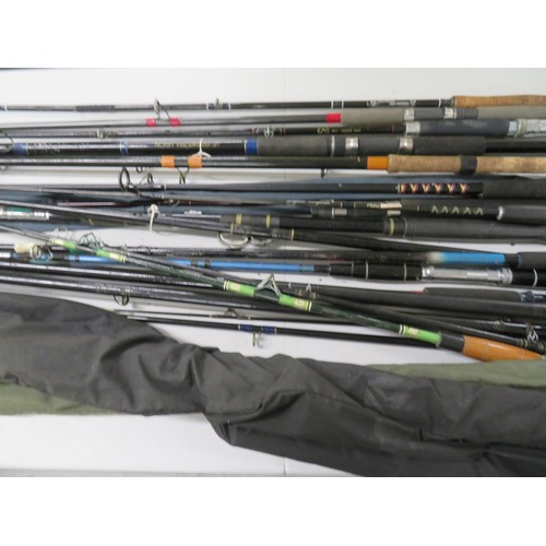 149 - Collection of fishing rods, mostly beach, pier and spinning plus a number of spare bottoms and tops