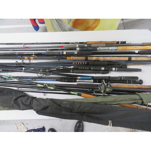 149 - Collection of fishing rods, mostly beach, pier and spinning plus a number of spare bottoms and tops