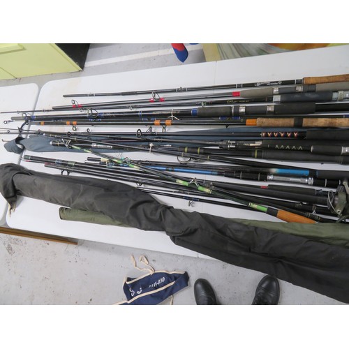 149 - Collection of fishing rods, mostly beach, pier and spinning plus a number of spare bottoms and tops