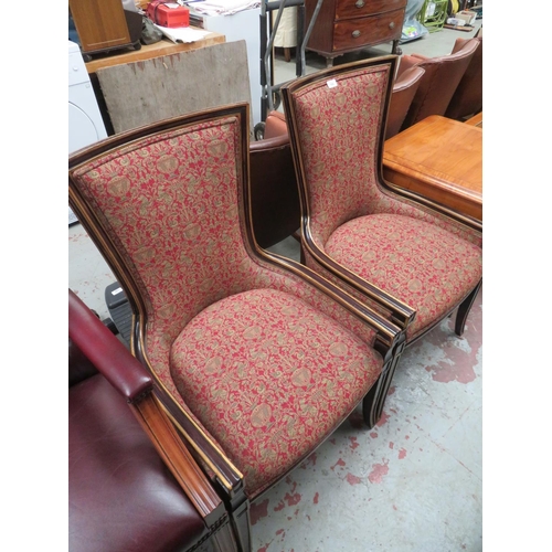 168 - Pair of chairs in red and cream upholstery with curved backs and sabre legs