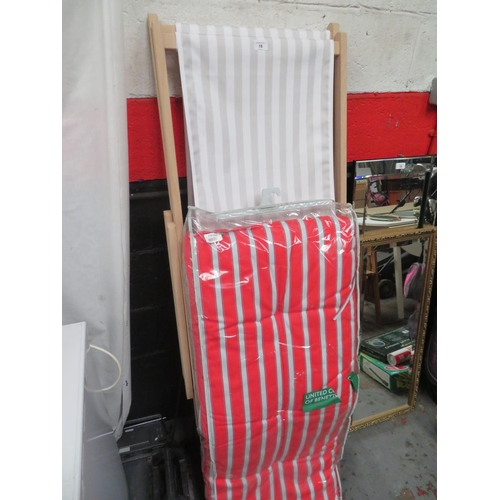 18 - Pair of new deck chairs plus a striped cushion