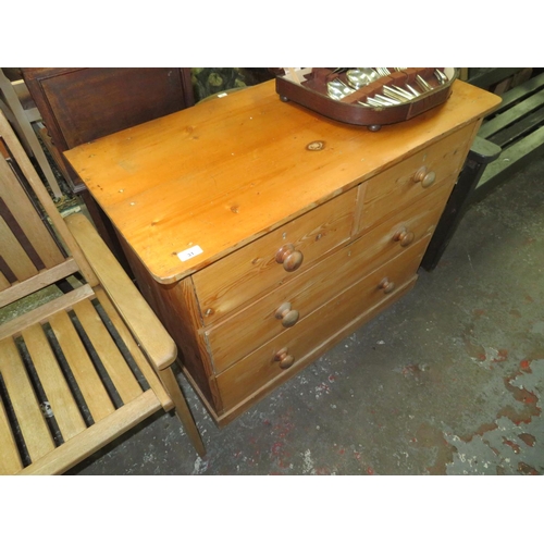 31 - Pine chest of two long and two short drawers with knob handles