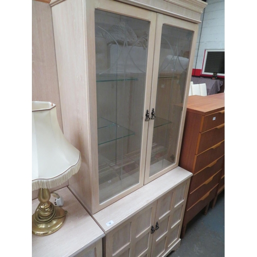 78 - Bookcase with glass doors and shelves and cupboard to base