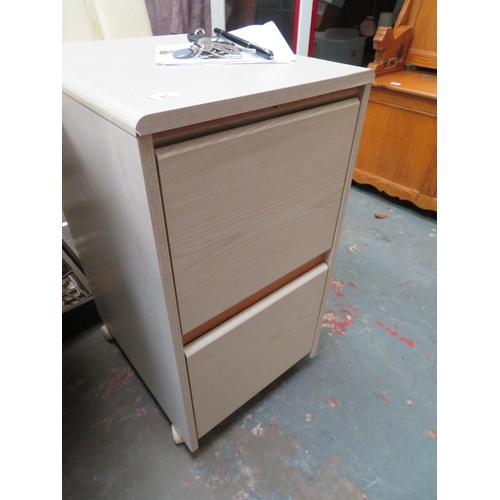 83 - Two drawer wooden filing cabinet on castors