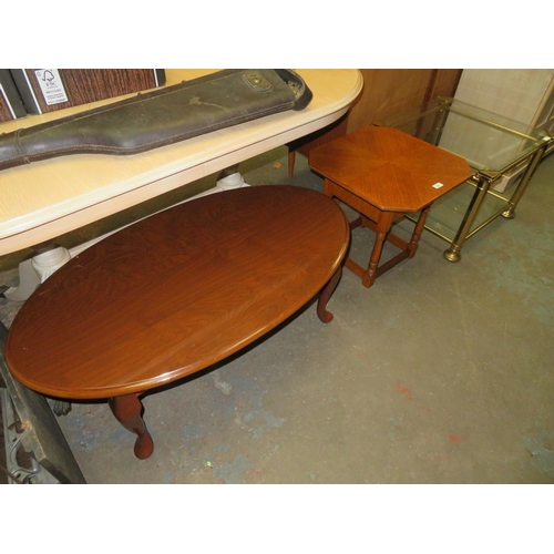 86 - Oval topped table, octagonal topped table plus a square glass and brass table