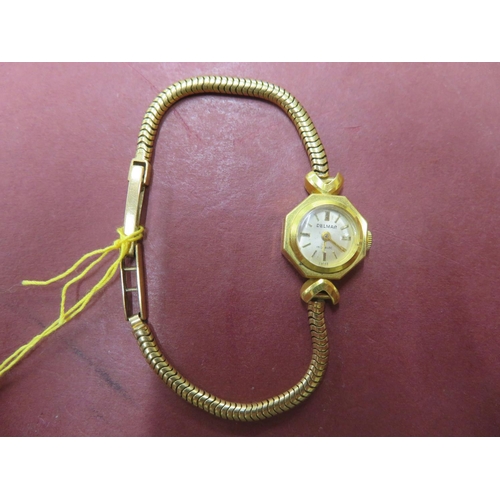 63 - 18 ct. gold ladies' Delmar wrist watch with 9 ct. gold strap - total wt. 15.5 grms