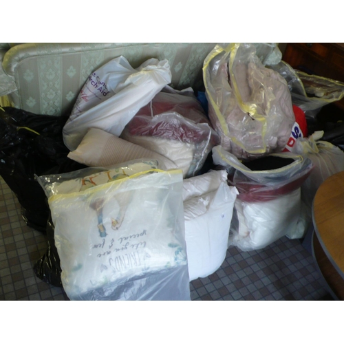 128 - Large collection of cushions, a throw, and material remnants