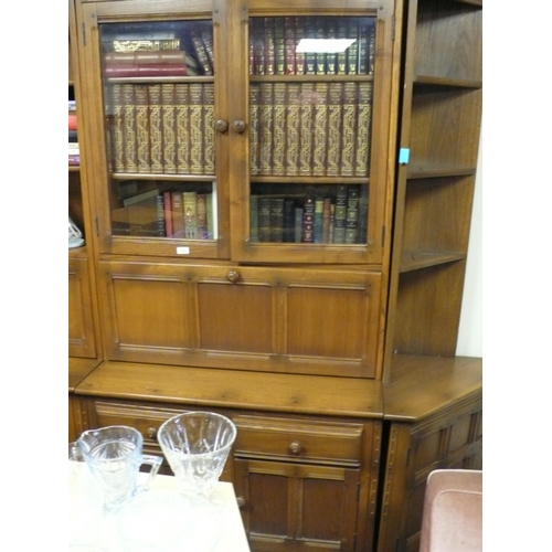 153 - Bookcase with cupboards and two drawers to base, pull down door, and glass doors and two shelves abo... 