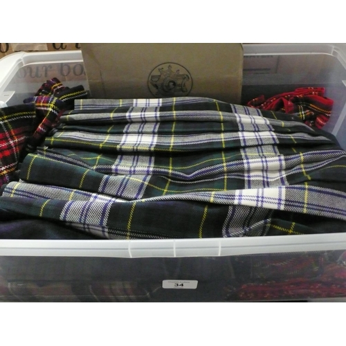 34 - Box of tartan material/skirts