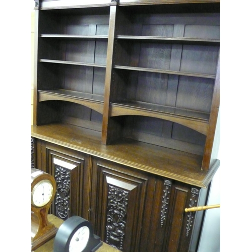 81 - Large wooden display cabinet with shelves to top and carved fronted cupboards to base