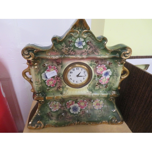 301 - Pottery mantel clock with floral painted decoration