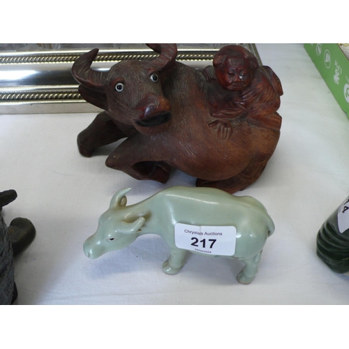 217 - Two carved water buffalo