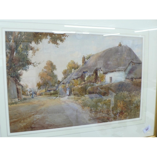 247 - J W Milliken, Feeding the ducks outside a thatched cottage, watercolour, signed, 13 x 20 ins