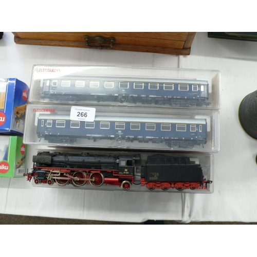 266 - FLEICHMANN H0 gauge locomotive and tender plus eight coaches (boxed)