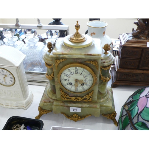 270 - A French green onyx mantel clock good quality chiming on a bell