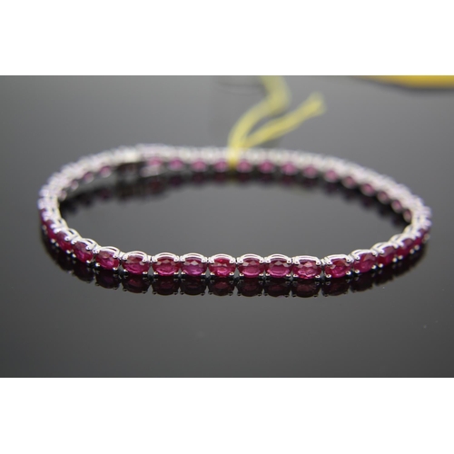 292 - 18ct white gold oval ruby line bracelet, 10.2carats of rubies