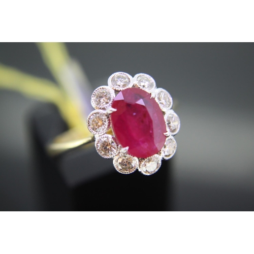 293 - 18ct yellow gold oval ruby and diamond cluster ring, ruby 2.2ct, Size Q