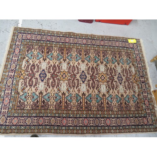 396 - Good quality carpet with geometric designs, five borders in red, cream, green and blue wools