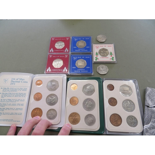 59 - Collection of seven Isle of Man Christmas and Legislative building 50p coins, plus three decimal set... 