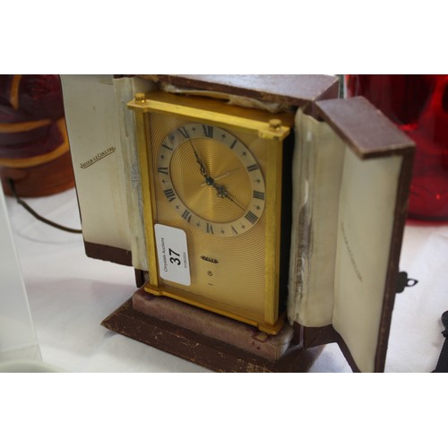 37 - Jaeger Le Coultre gilt metal 8 day alarm travel clock - cased - ticking height 6.5ins