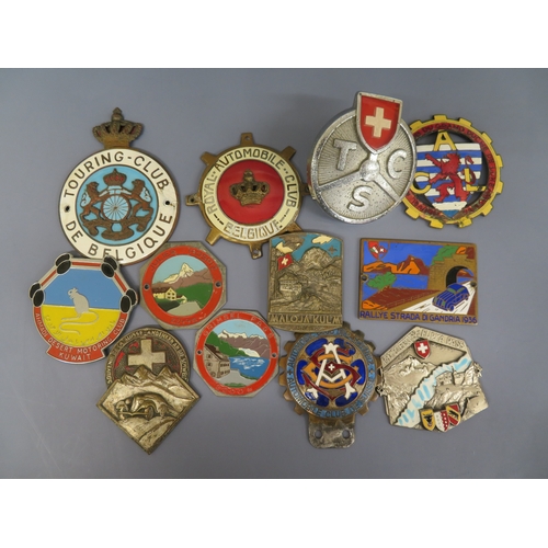 129 - Good collection of foreign car badges:-
Touring Club De Belgique
Royal Automobile Club Belgique
TCS ... 