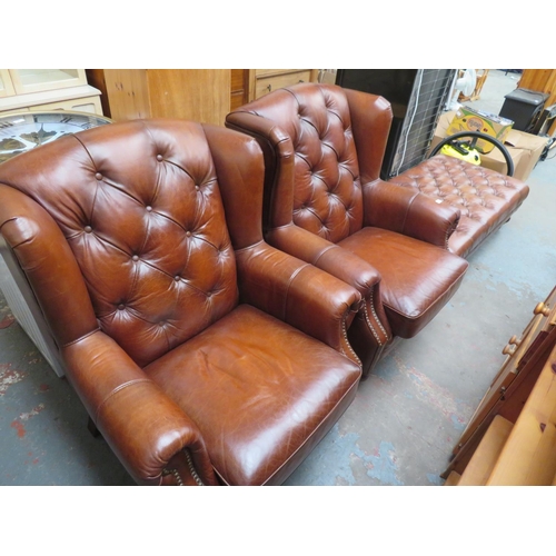 46 - Pair of button back brown leather arm chairs plus a large matching footstool