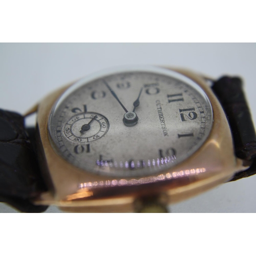 305 - A Gent's Cuthbertson gold cased wrist watch on a leather strap, marked 375