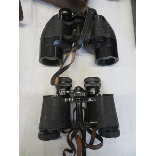 342 - Two cased pairs of binnoculars