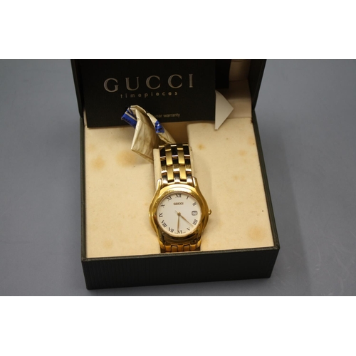 479 - A boxed Gucci wrist watch with spare links