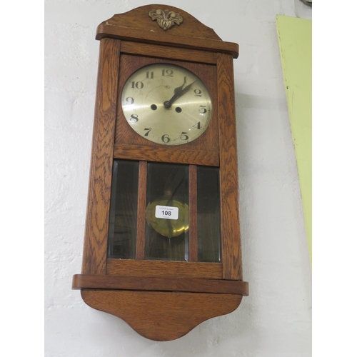 108 - Oak cased wall hanging clock