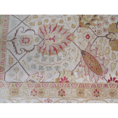 112 - Good quality rug in mostly cream and yellow wools with floral design, approx 112x73ins