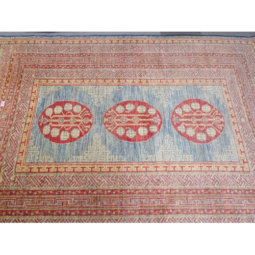 83 - Good quality Samarkand rug in mostly blue red and cream wools, geometric designs, 81x59ins approx