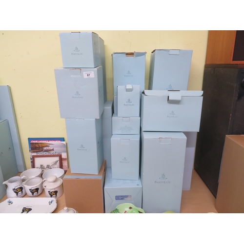 87 - Large collection of boxed, as new Partylite candleholders and accessories